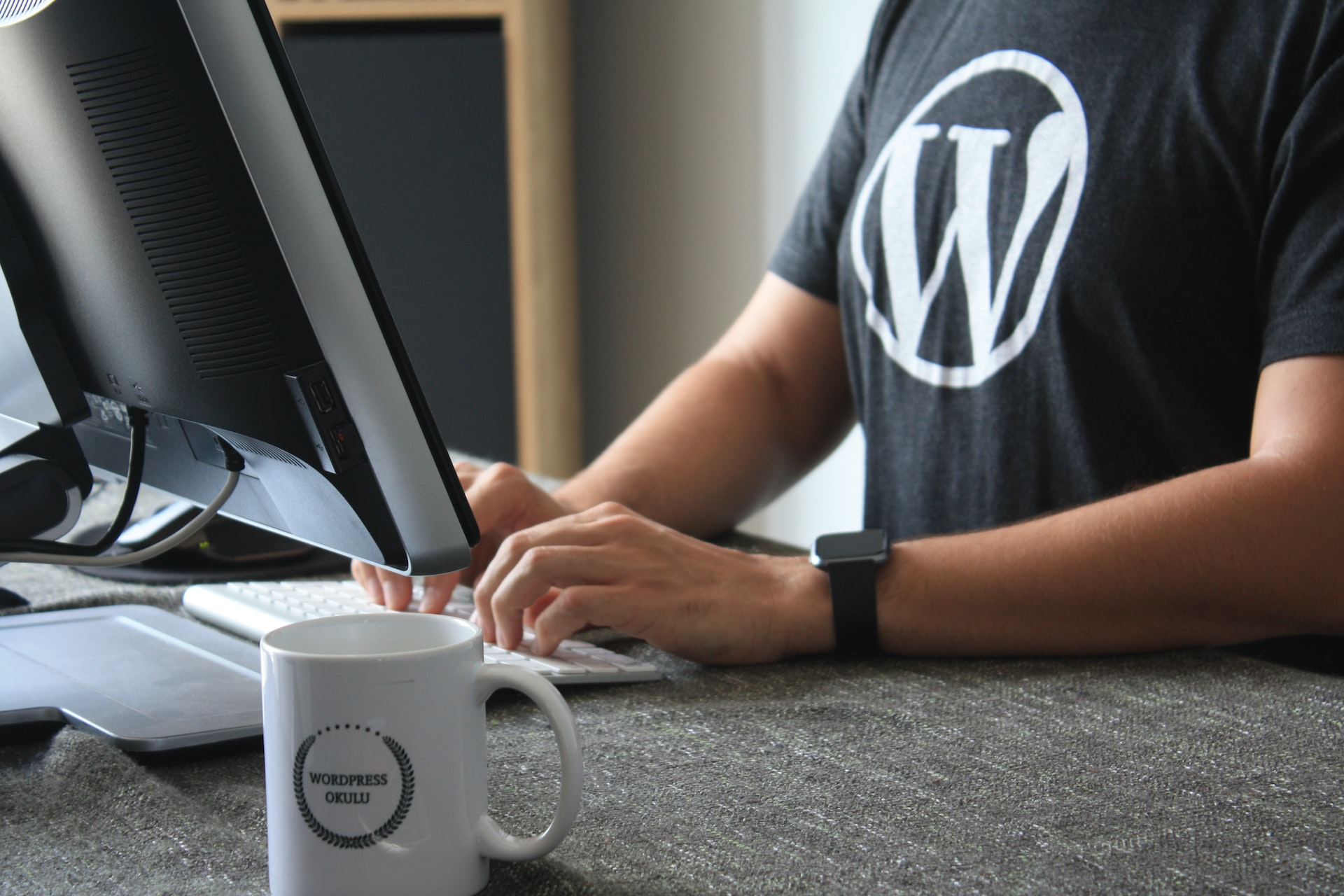 man designing website on wordpress